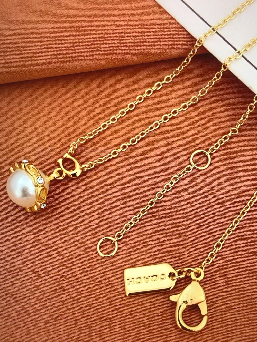 COACH Gold Pearl Charm Necklace - Gold and White - Picture 2 of 5